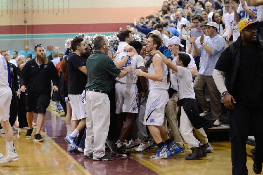 The team celebrates with fans after clinching the regional championship. Photo by Michelle Jarcho.