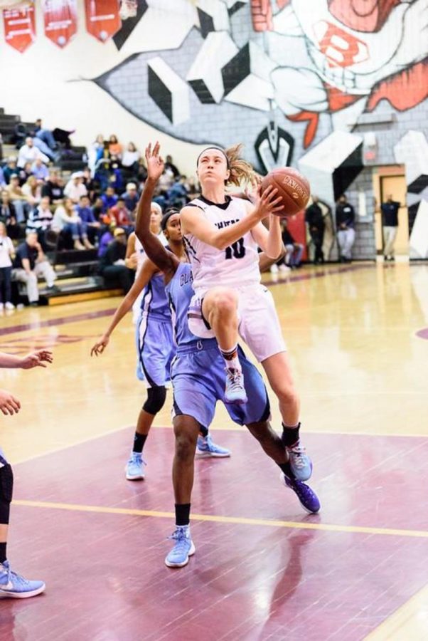 Abby Meyers drives to the hoop in the girls basketball teams regional final victory over Clarksburg.