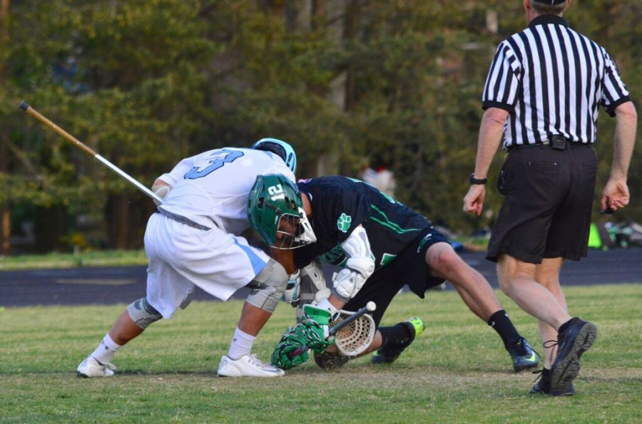 Defender Daniel Fraser is locked in a face-off during a tightly contested game against Walter Johnson. Photo courtesy of Keith Greenberg.
