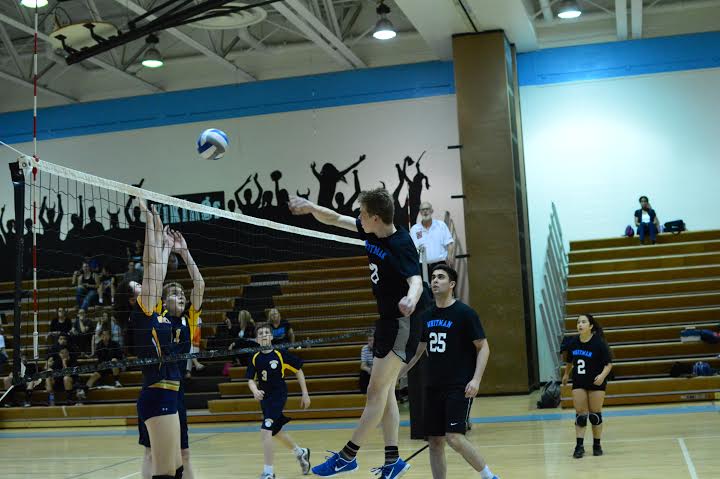 Hitter Gideon Crawford unleashes a spike in a 3–1 victory over B-CC. Photo courtesy Tomas Castro.