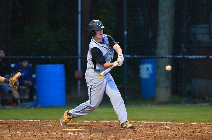 Third baseman Tyler Demartino drills a fastball for a base hit against Wootton. Demartino had multiple hits on the night. Photo courtesy Whitman baseball.