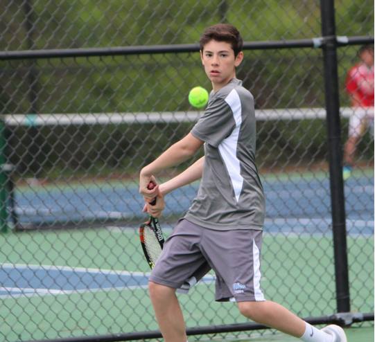 Freshman Jared Lapidus winds up for a strong front handed hit to his opponent. Photo by Olivia Matthews.