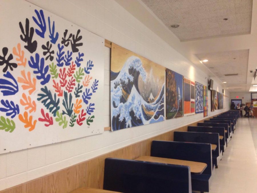 The art currently hanging in the cafeteria is years old, and in need of an update. Photo by Tiger Björnlund.