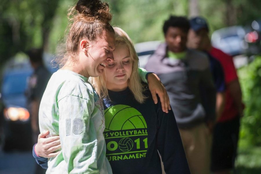 Damascus High School juniors Courtney Witmer, 16, left, and Baleigh Louro, 17, visit the crash site. Photo by Amanda Voisard/For the Washington Post.