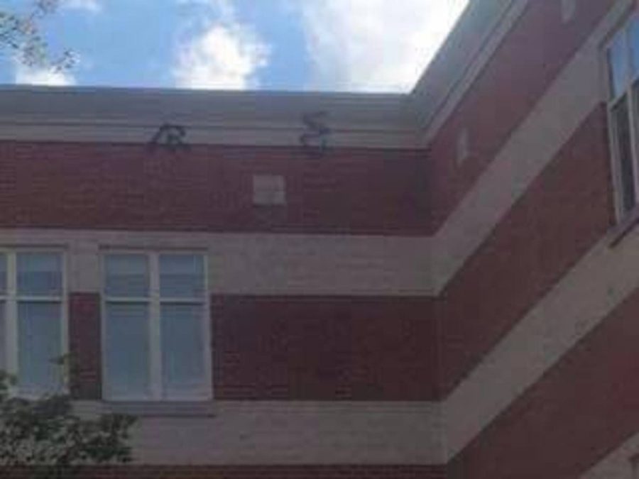  Symbols that were spray painted on to the roof this summer as part of the vandalism were visible from the courtyard, and have since been removed. Photo courtesy Cherisse Milliner.