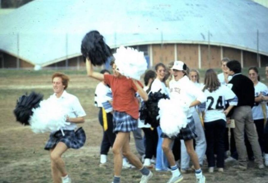 Football players cheer during the 1980 powderpuff football game. Photo courtesy Tracy Farrell Jenkins