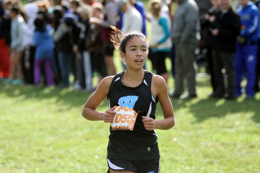 Freshman Paula Bathalon races at the county championships on Oct. 22. Bathalon finished 17th in the state in the three mile race. Photo courtesy MoCo Running