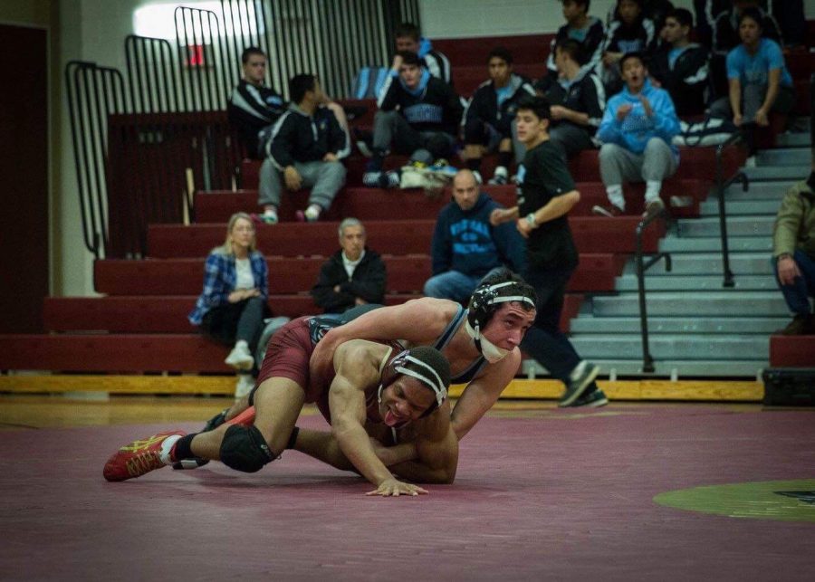 Sophomore Ben Gersh pins his opponent at the team’s match against Paint Branch December 20. Photo by Shannon Turkewitz.