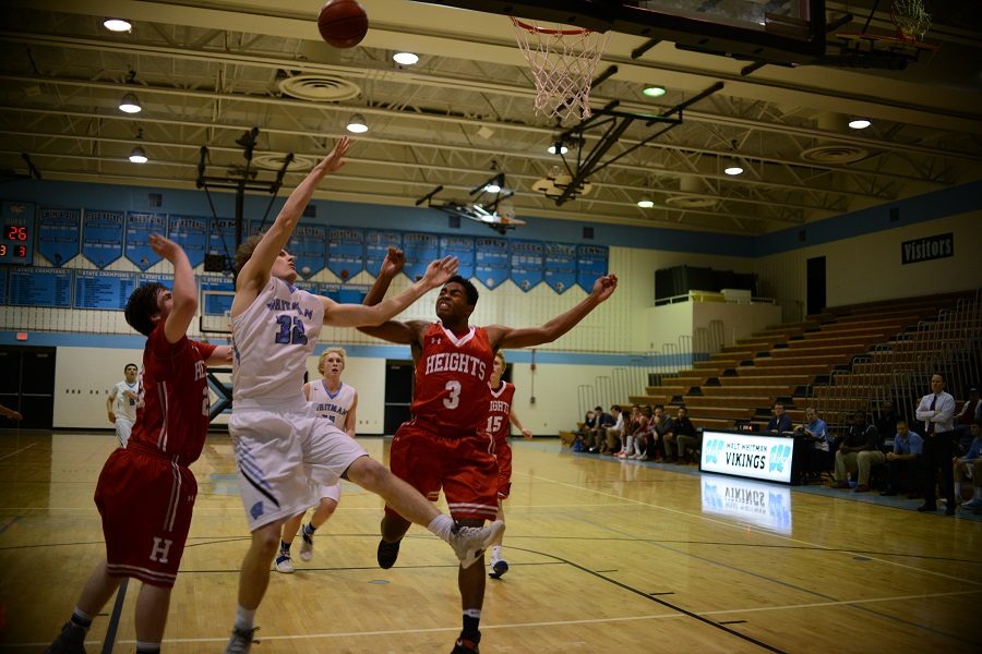 Forward Adam Smith goes up for a contested layup in the teams lopsided 27 point victory. Photo by Annabelle Gordon. 