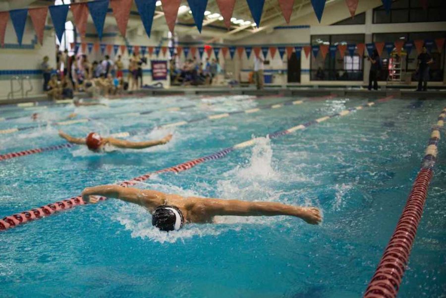 A Whitman swimmer flies past the competition during a meet against Wooton.