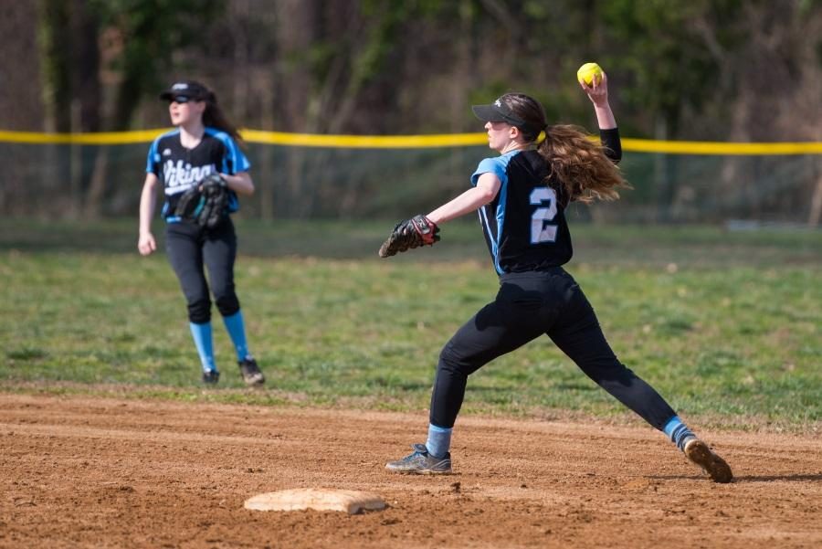 Infielder Laura May throws the ball across the diamond in the team's 17–4 loss against Seneca Valley. Photo by Jefferson Luo.