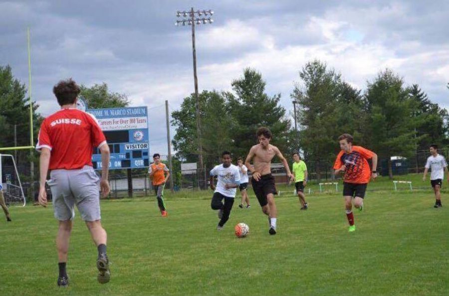 Players rush towards the goal, attempting to further their team at the international clubs third annual soccer tournament May 26. Photo courtesy Eduardo Monteiro and Laura Klemola.