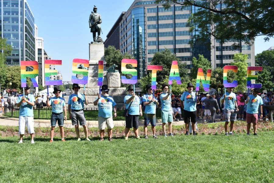Men demonstrate at the Pride Parade June 10. Many Whitman students attended the event to show their support for Whitmans LGBTQ+ community. Photo by Mira Dwyer. 