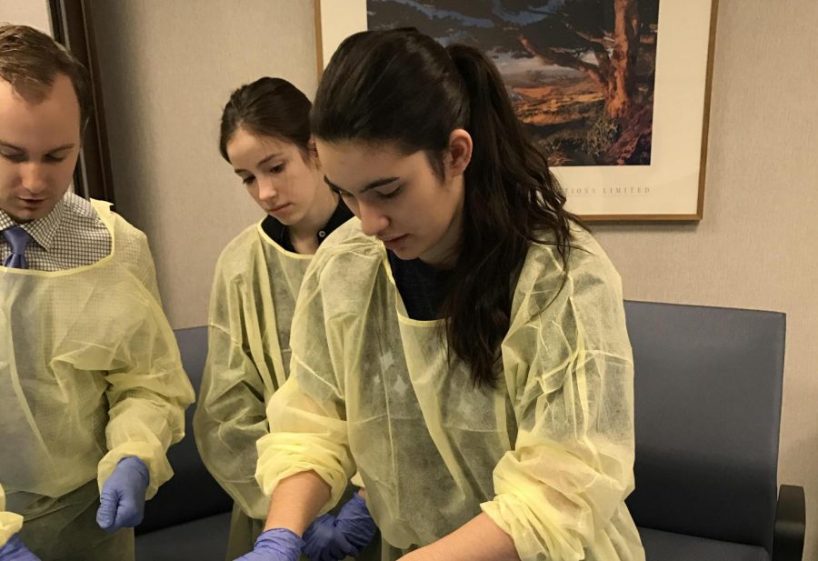Sophomore Kalia Dell operates on a heart for her internship. Dell decided she wanted to be a doctor after experiencing medical setbacks herself. Photo courtesy Kalia Dell. 