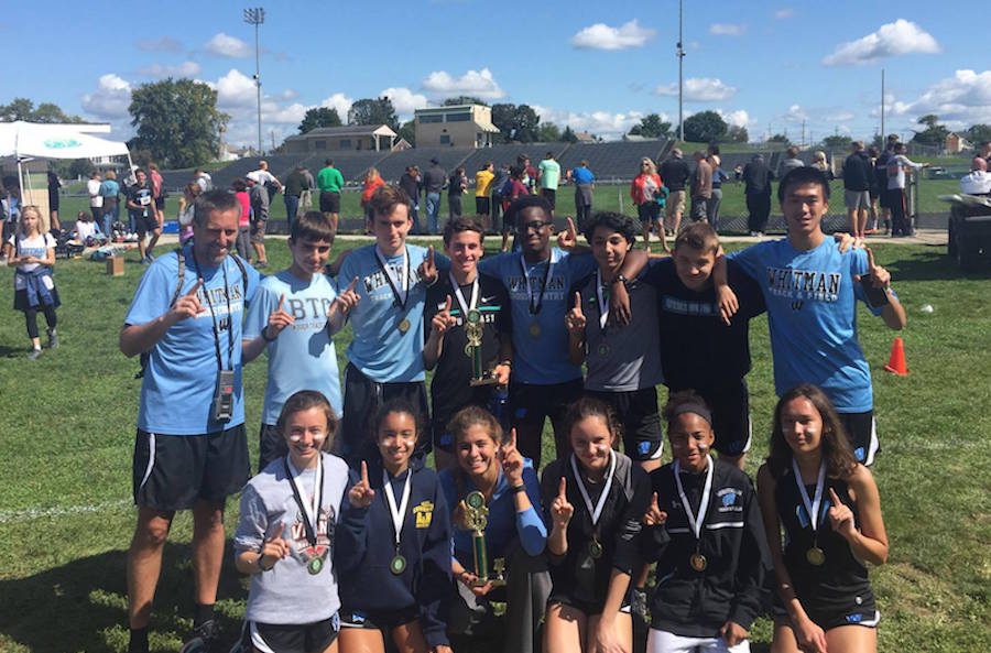 Varsity cross country and Coach Hays runners pose after sweeping both races at the Rebel Invitational Sept. 9. The team next races at Oatlands Plantation September 16. Photo courtesy Matthew van Bastelaer