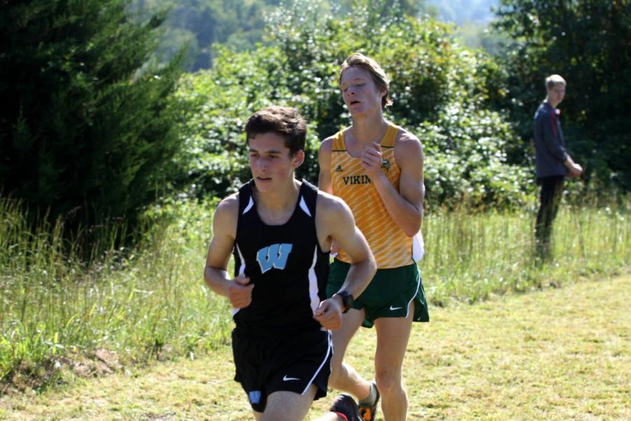 junior Aaron Bratt sprints his way to a second place finish. Photo courtesy of Mocorunning