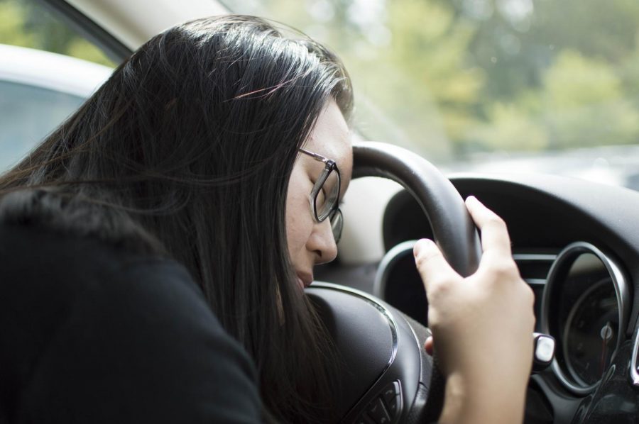 A student falls asleep at the wheel. Though typically overshadowed in publicity by texting-while-driving and drunk driving, many parents and specialists have recently shifted attention to drowsy driving. Photo by Annabelle Gordon. 