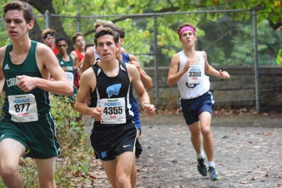 Junior Aaron Bratt rounds a curve in a race. Bratt, along with the rest of the cross country and treack and field teams, follow pre-set runs that are simple and vary in difficulty and length. Photo courtesy MileSplit. 