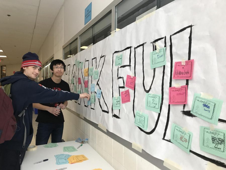 Students pin their notes on a banner in Whitmans front hallway. Sources of Strength started the Turkey Campaign to allow students to write what theyre thankful for. Photo by Yiyang Zhang. 