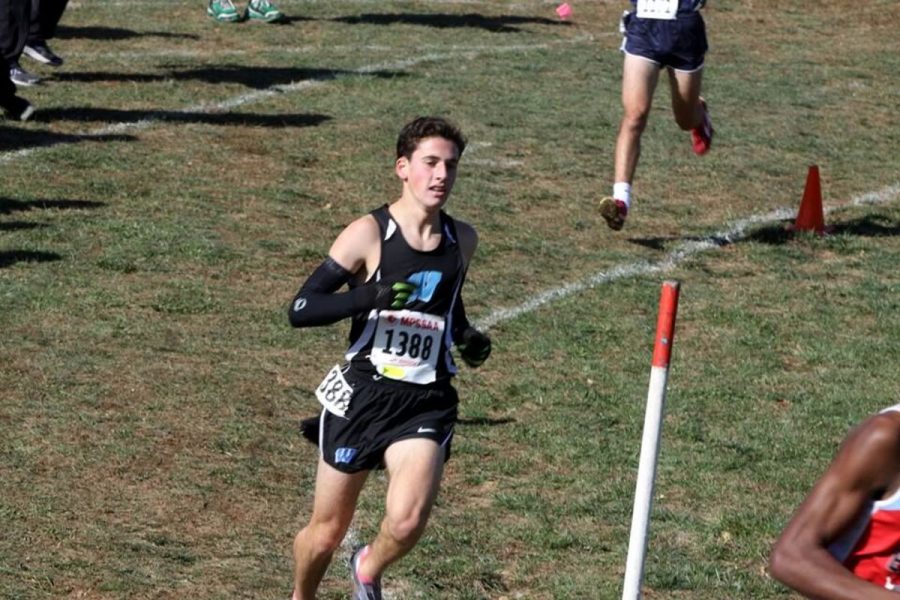Junior Aaron Bratt runs at the Cross Country 4A State Championships Nov. 11. Bratt runs Cross Country and both indoor and outdoor track, making for a variety of different workouts and mental preparation. Photo courtesy MoCoRunning.