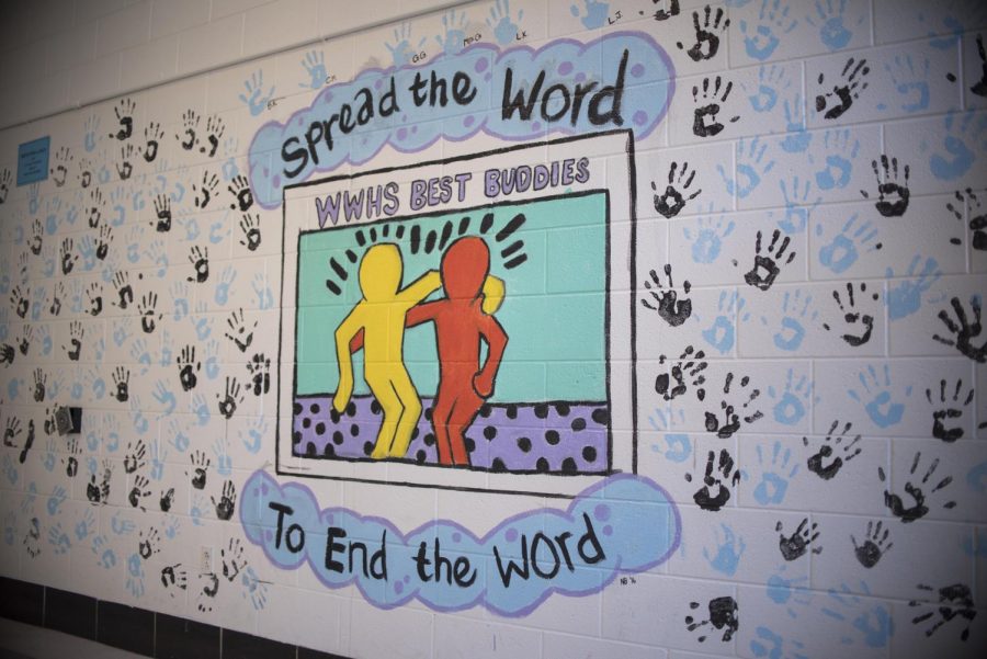 A mural sponsored by Best Buddies featuring hand-prints of those who donated to the club and pledged to end the use of the R-word. Every March, Best Buddies participates in Special Olympic’s “Spread the Word to End the Word” month to end the everyday use of the R-word. Photo by Annabelle Gordon. 