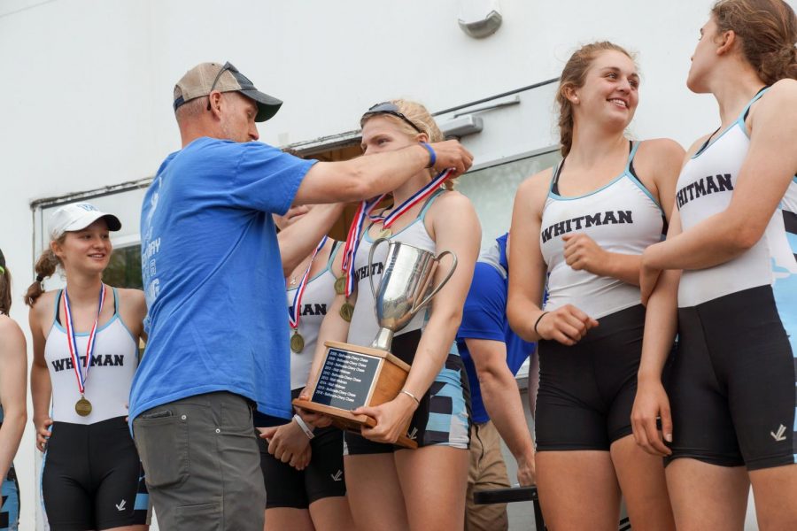 The girls varsity crew team receives their gold medals after coming in first at the Washington Metropolitan Interscholastic Rowing Association championships. The team won the regatta for the second straight year, upsetting favorite the National Cathedral School. Photo courtesy of the girls crew team.