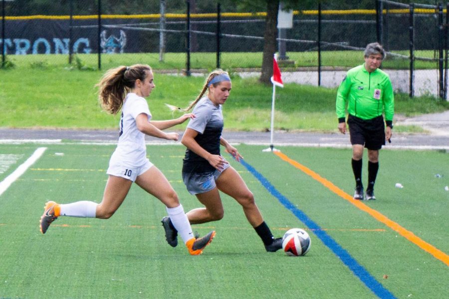 Forward Isabella Bravo cuts past a B–CC defender. The team defeated the Barons in the Battle of Bethesda, a key win as they near playoffs. Photo by Lukas Gates.
