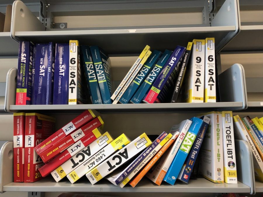 College test prep books sit on a shelf in the CIC.