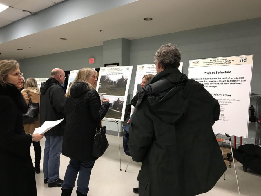 Community members discuss SHA proposals at a community meeting on Jan. 15 in the Pyle middle school cafeteria. An option will be decided on in the coming months and construction plans will be finalized at the end of the year. Photo by Anna Yuan.