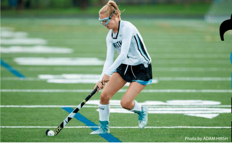 Senior Hanna Freund dribbles down the field for the field hockey team—her fourth varsity Whitman sport. She joined this year after tennis was moved to the spring. 