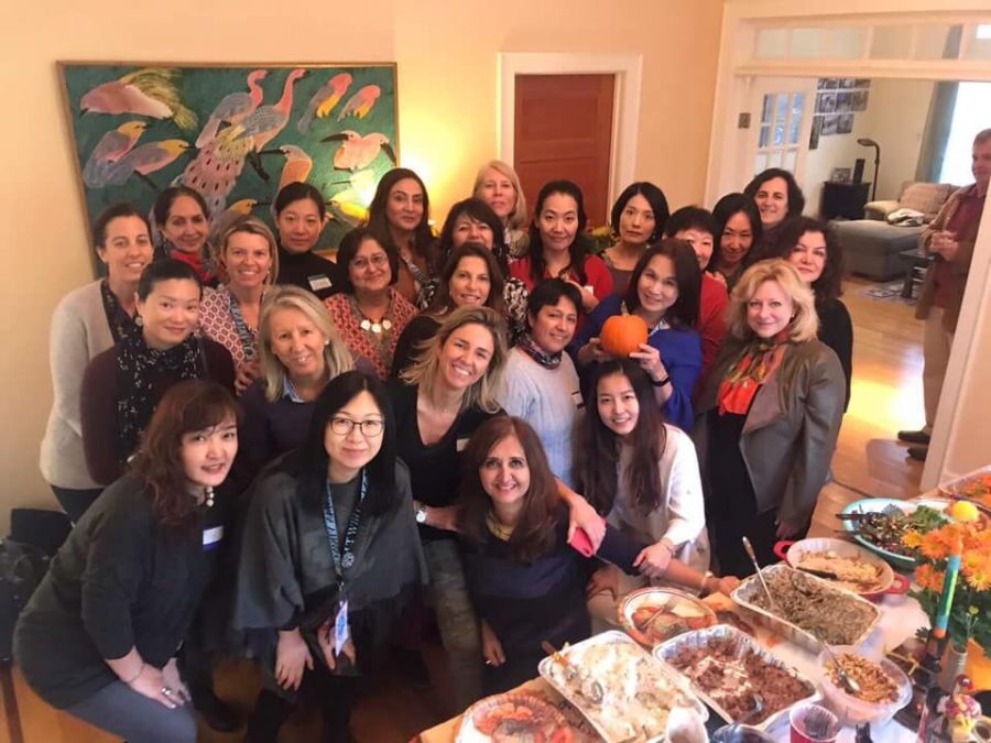 Whitworld members gather in Kim Weichel's house for their annual Thanksgiving party. Whitworld is a parent club established in 2009 to welcome new parents into the Whitman community.