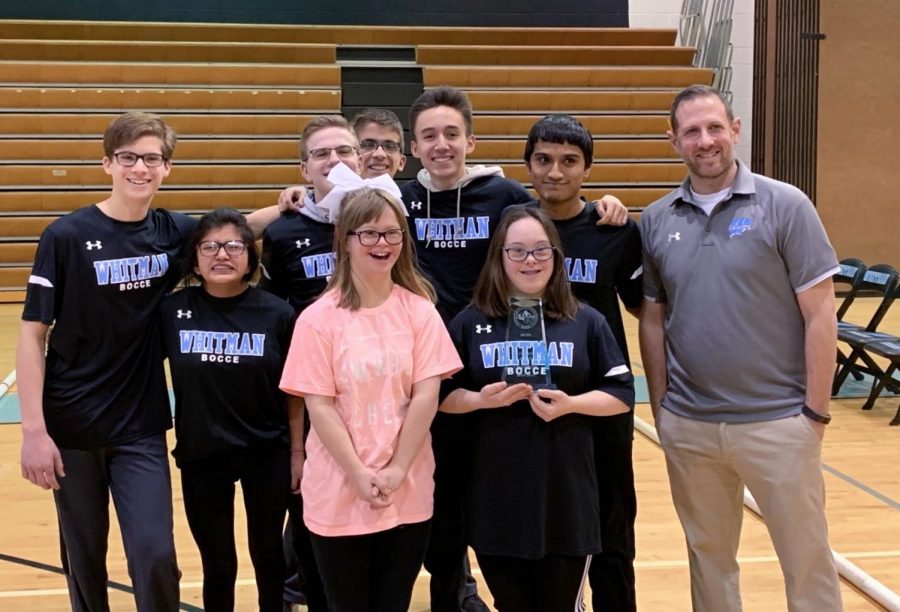 The bocce team poses with their trophy after winning the divisional championship last Saturday.  The win earned the team their second straight division title.