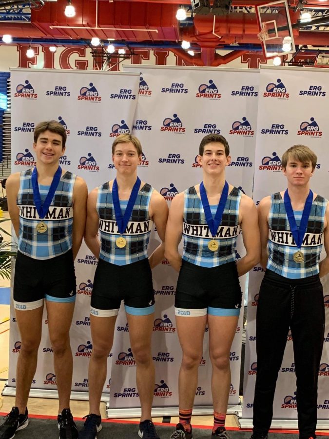The quad slide team poses with their first place medals at the Erg Sprints competition. The team competes indoors in the winter while the river is frozen. 