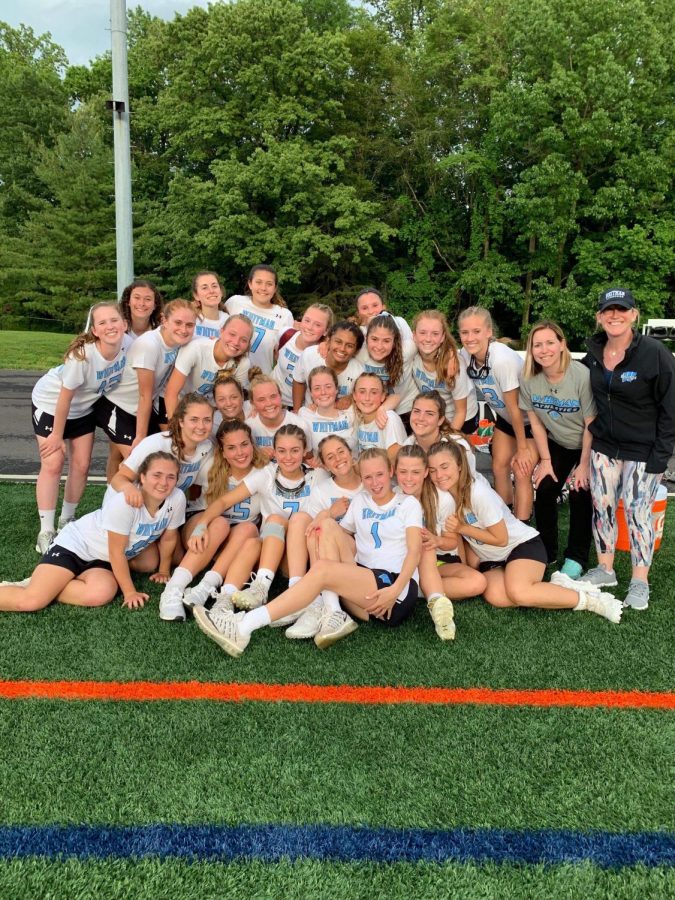 The girls lacrosse team celebrate their 7–4 playoff win against the Walter Johnson Wildcats. Photo courtesy of Rachel Svec. 