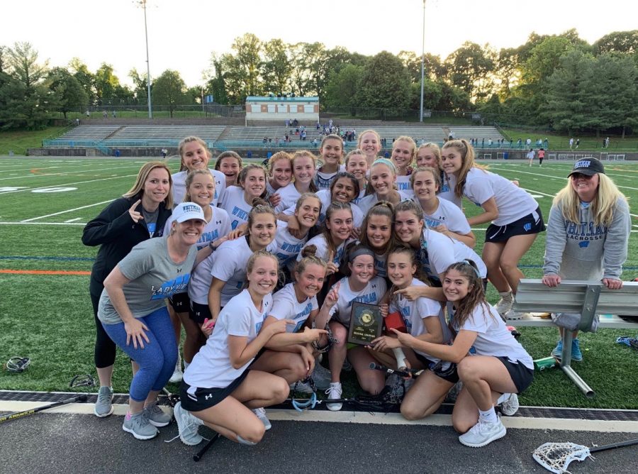 The girls lacrosse team poses for a team picture after the Vikes defeated the Richard Montgomery Rockets to advance to the state semi-finals. Photo courtesy of the Whitman Girls Lacrosse Twitter. 