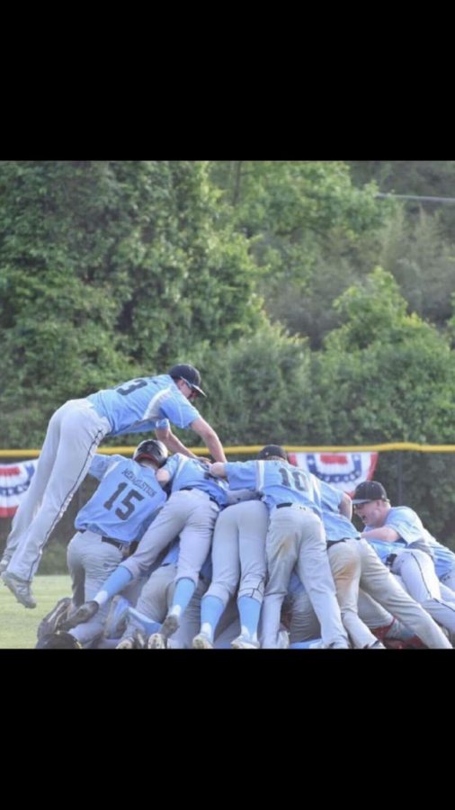 The baseball team piles on second baseman Harry Kaplan after the Vikes walk-off win against the B–CC Barons to advance to the regional final of the state playoffs. Photo courtesy of Joey Sussman. 