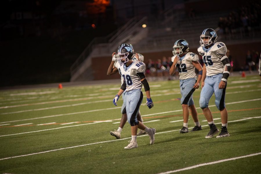 Cornerback Peyton Casamento and linebackers Luke Cullinane and Morgan White walk off the field in the Vikes 49–7 win over B–CC. Photo courtesy of Charlie Sagner. 