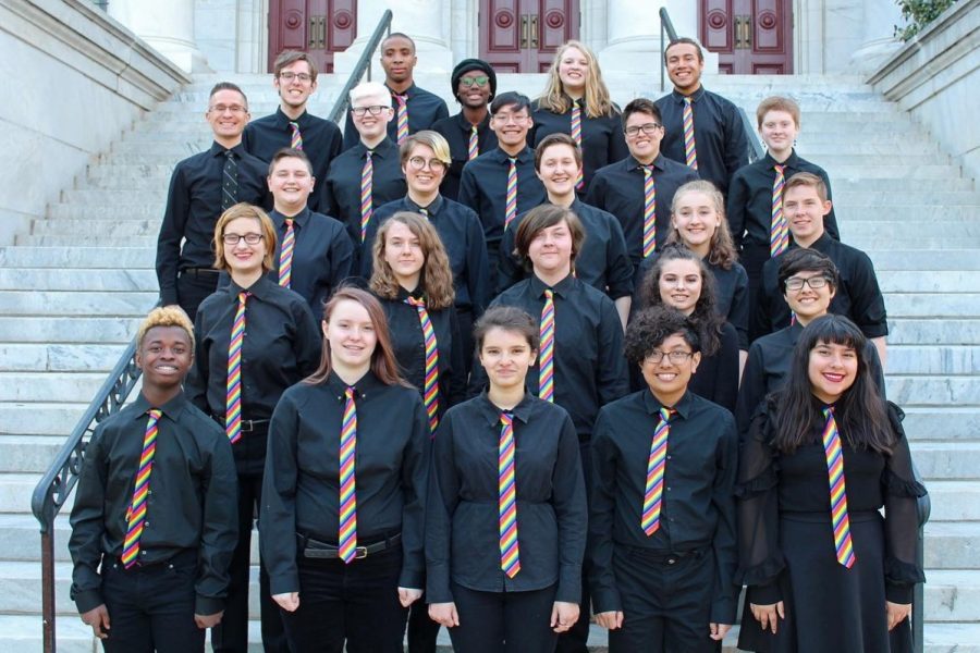 The members of the 2018-2019 GenOUT chorus pose wearing their concert attire.