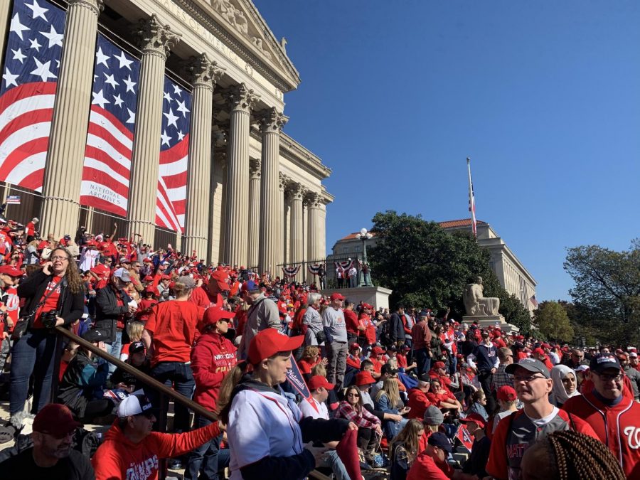 Fans stand in front of the National Archives to watch the World Series Parade Nov. 2.