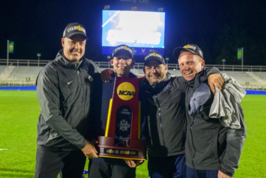 %28From+left%29+Georgetown+Mens+Soccer+coach+Brian+Wiese+celebrates+winning+the+NCAA+championship+by+holding+the+championship+trophy.