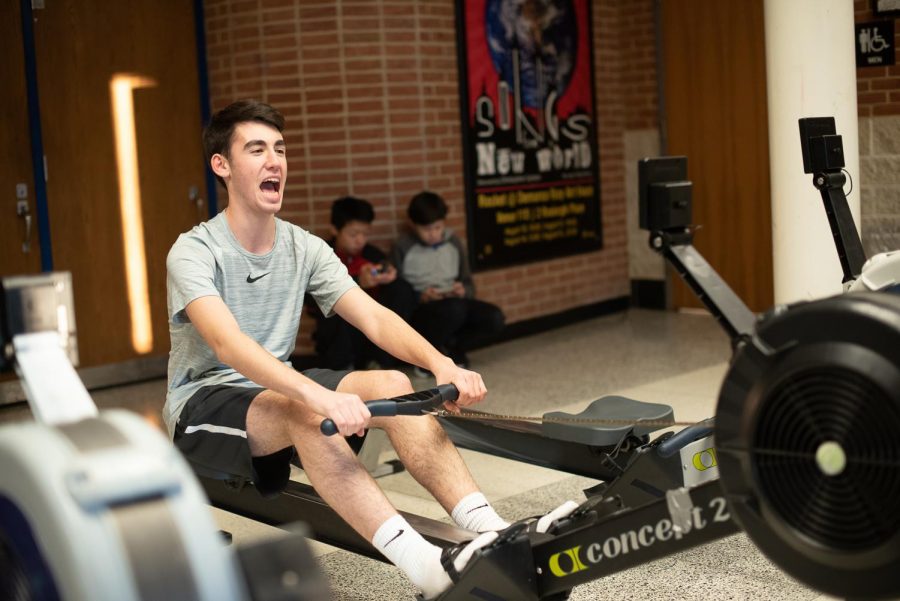 Junior Taylor Haber attempts to row on an erg after losing all feeling in his lower body.
