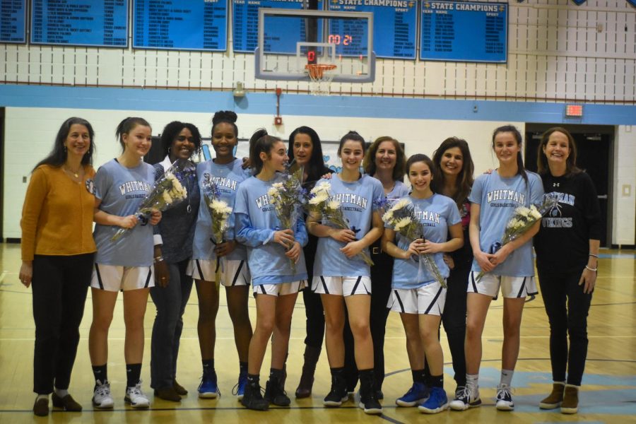 The six seniors pose with their moms after their win Friday night. The seniors were honored before the game as a celebratory end to four years as part of the Whitman basketball program. Photo courtesy of Kaya Ginsky. 