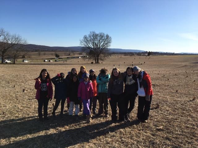 Troop Four poses during their camping trip to Antietam National Battlefield in December right before being able to light lumineers on the battlefield.