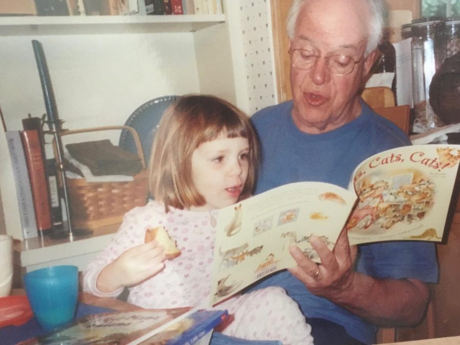 My grandfather reads me a picture book.