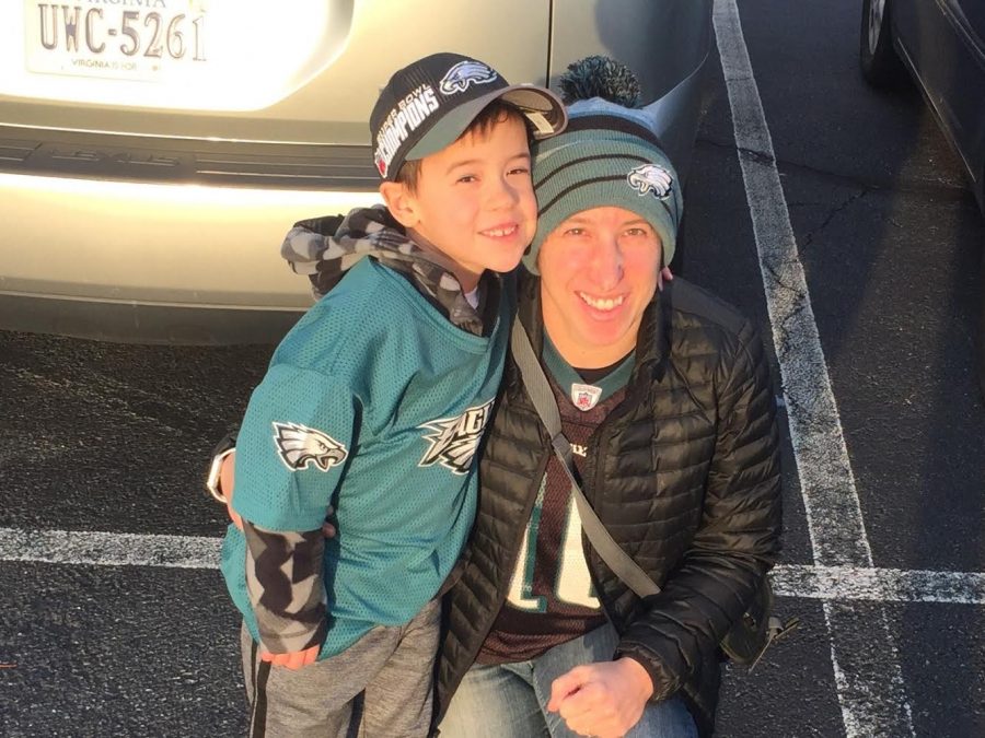 Psychology teacher Sheryl Freedman and her son pose for a photo before watching the Philadelphia Eagles take on the Washington Football Team.