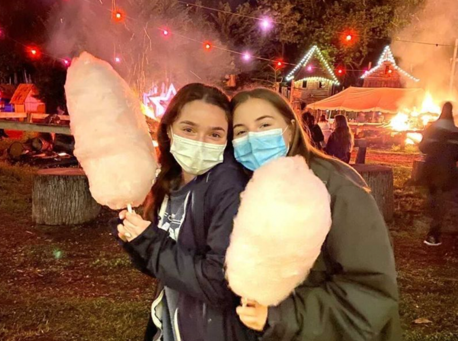 Seniors Olivia Eisenberg (left) and Lily Robinson (right) enjoy the festivities at Post Prom. The Calleva Farm party consisted of a variety of carnival game booths, a haunted trail and snacks for seniors to enjoy.