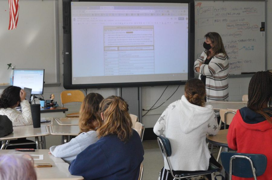 Women's Studies teacher Linda Leslie introduces a research project to her class. Women's Studies is one of the five classes offered as part of the Leadership Academy for Social Justice.