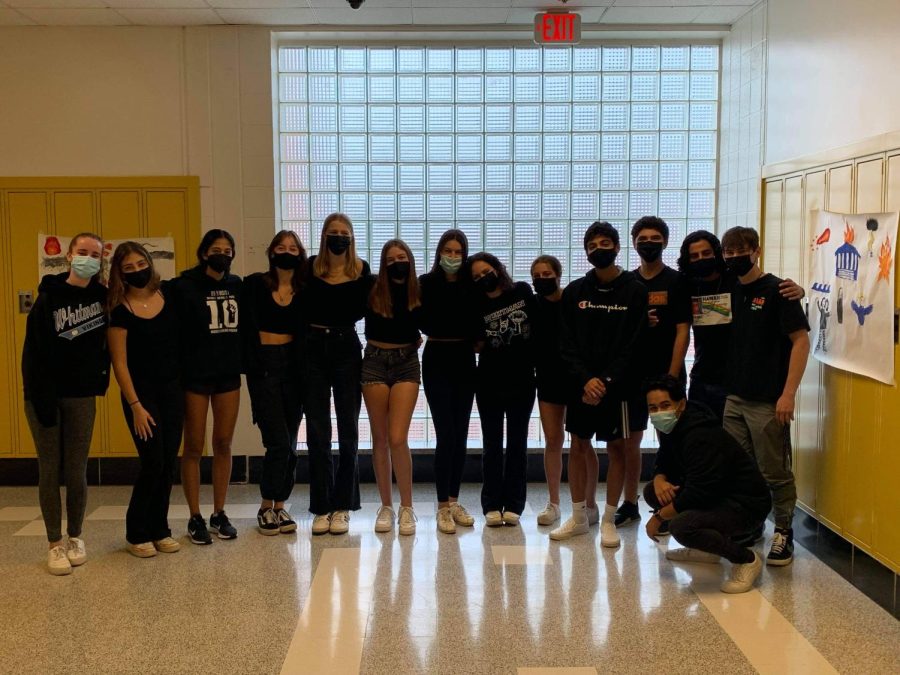 AP Spanish Literature students pose in black attire during first period on Friday as a symbol of unity against prejudice in MCPS.