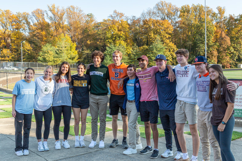 The 12 committed student athletes from the graduating class of 2022 pose for a photo.