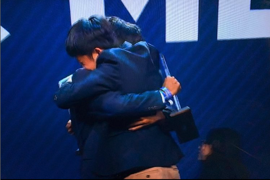 Juniors Justin Yang and Rohin Dahiya exchange a hug after winning first place in their event at the ICDC.
